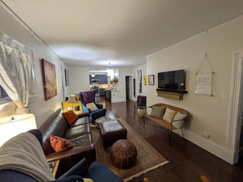 View of the open floor plan from the front of the house toward the kitchen.