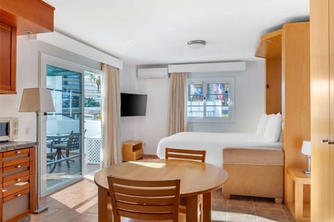 Combined living and dining space with natural light for a comfortable stay.