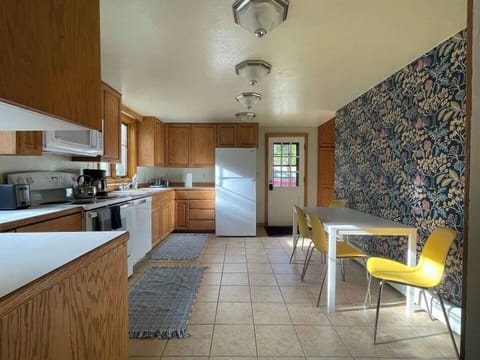 Kitchen looking from the downstairs bathroom to the back door