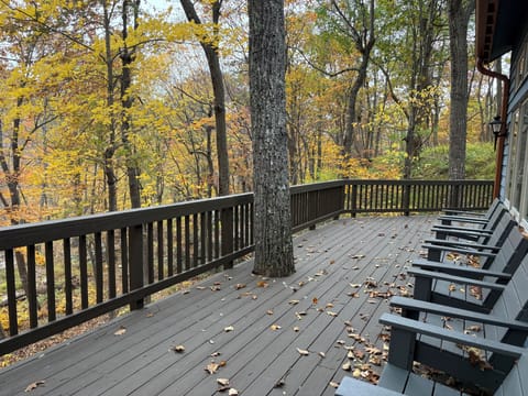 back deck off main level with view to woods and stream