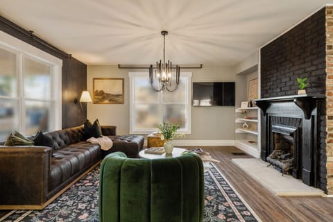 Our chic living room boasts a fabulous 56" smart TV for movie nights or streaming your favorite shows. Sink into the cozy L-shaped couch, with throw pillows and blankets for ultimate relaxation. Natural light pours in, creating a bright and inviting ambiance. The couch can be used as a bed for an extra guest if needed! With an open floor plan, you'll find the kitchen and dining...