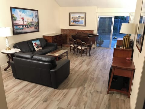 Living Room with baby grand piano, television, and stereo