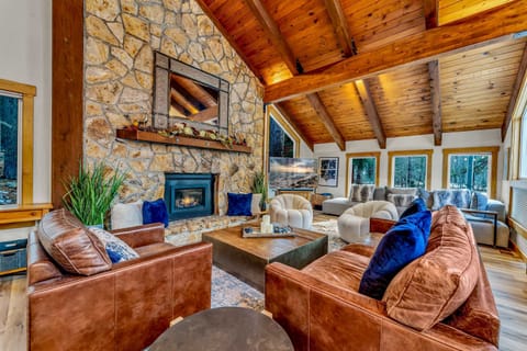 Living room: Spacious main floor area with a gas fireplace and Smart TV with basic cable, Central heat and A/C