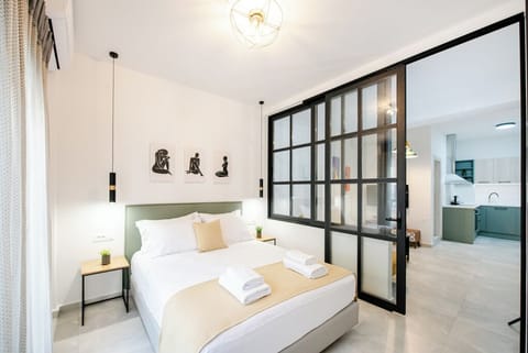 A stylish, cozy bedroom with warm tones, elegant furnishings, and a luxe feel.