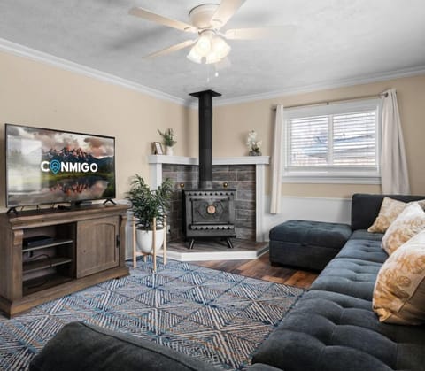 Cozy living room with smart TV & fireplace