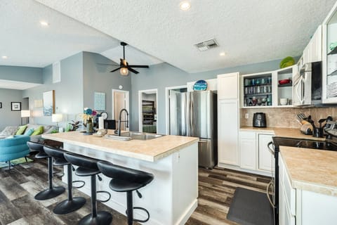 Grab a snack or watch the chef in action from the breakfast bar seats