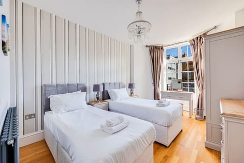 Bedroom 1 (with a balcony): Zip and link bed, which is set up as two single beds by default or can be zipped together to form a king-size bed upon request.