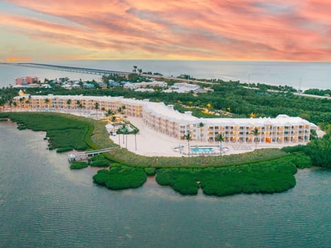 Aerial views of this lush coastal escape highlight the perfect blend of luxury and natural beauty.