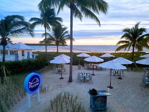 Beachside dining under the evening sky, where the ocean breeze complements the relaxed atmosphere.