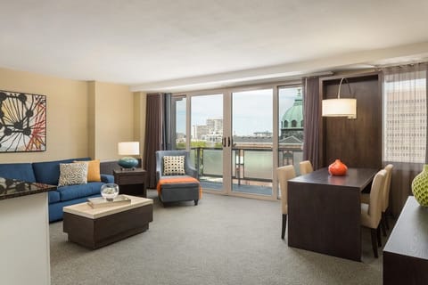 Relax in the sunlit lounge with skyline views beyond.