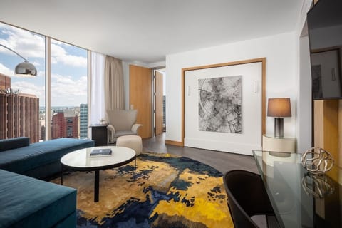 Lounge in style beside bold art and a sunny seating area.