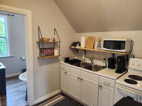 The kitchen is fully stocked with all the essentials needed to cook a meal