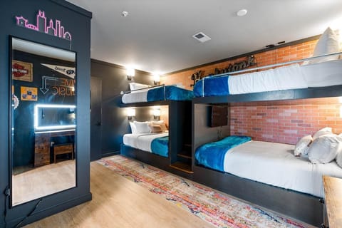 Epic Bunk room: Bonus room with 2 sets of built-in queen bunk beds, smart TVs, and vanity, and direct access to a large bathroom w/ double vanity, shower, and closet space.