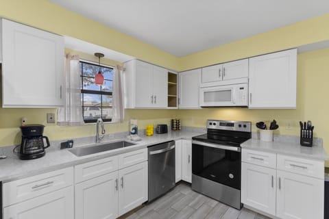 Fully equipped kitchen with modern appliances for all your cooking needs.