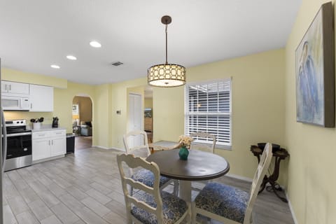 Dining area with comfortable seating for 4 people.