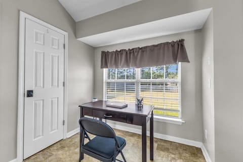 Private office with a desk, guest experience notebook, and pens.