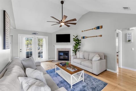Living room includes a Maggie sofa and loveseat, a coffee table, 55-inch Roku TV, direct backyard access, 2 accent books, and an open concept for you and your group to feel at home.