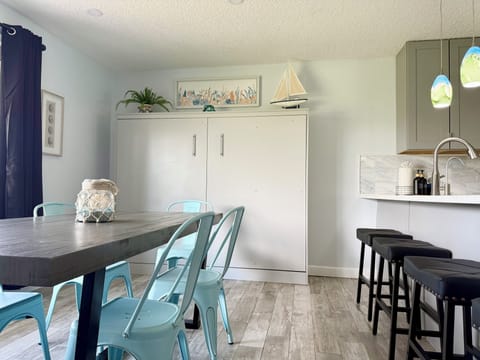 Queen Murphy Bed located in the dining area of the home.