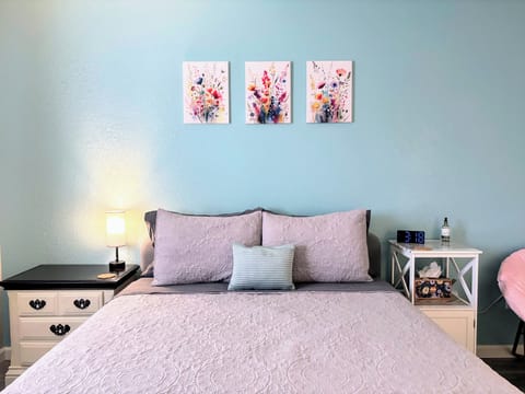 Primary bedroom with plush bedding and a relaxing, cozy atmosphere
