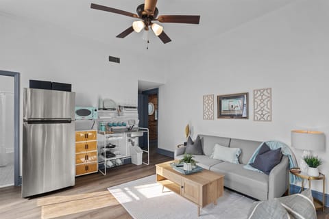 view of the living room and kitchenette with refrigerator/freezer