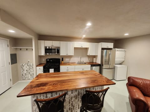 Main level great room (Kitchen View) with private washer/dryer.