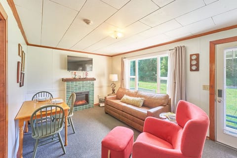 Bright and cozy living room with a comfy queen sofa bed — perfect for extra guests. 🛋️☀️