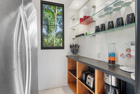 A stylish pantry space with open shelving, perfect for keeping essentials organized.