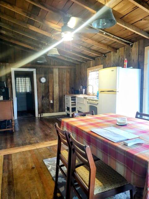 Large restored kitchen includes open oak ceiling