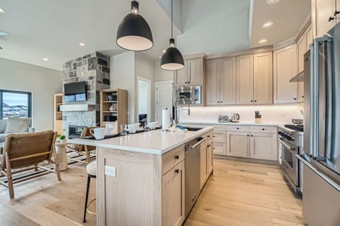 Your open-concept haven features a gleaming kitchen island where you'll prepare meals while chatting with loved ones in the bright living space.