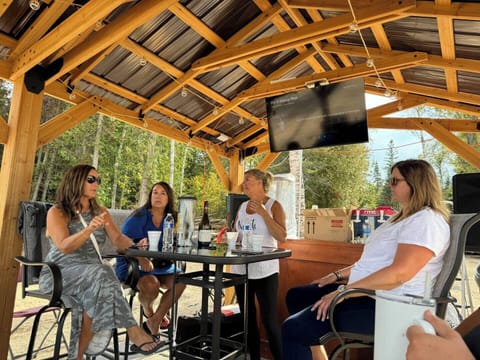 Covered bar area provides tables and chairs for a meal.