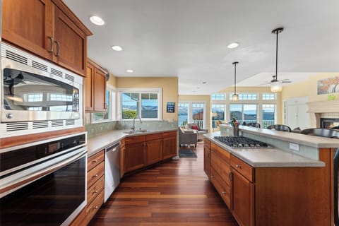 Kitchen with microwave, frig, oven, coffee maker, Keurig & gas cooktop