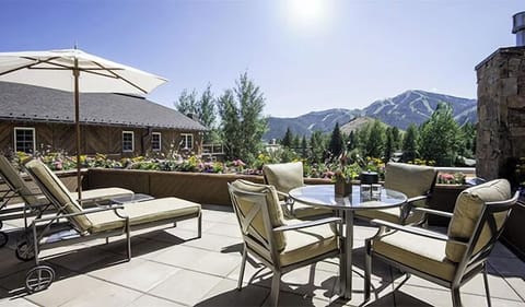 Sip morning coffee on the sunlit terrace with mountain views