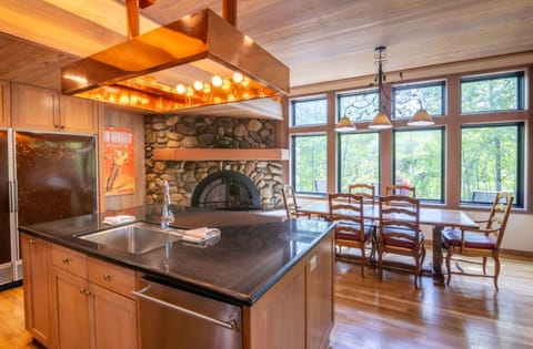 Cook together in a chef-worthy kitchen with warm wood tones.