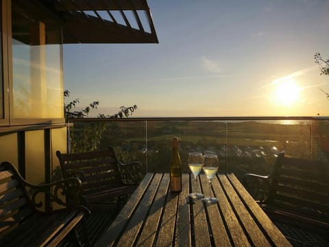 Wine and glasses on the table on the balcony at Nautilus