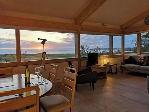 Dining table and chairs, telescope to look at the view