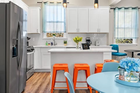 Pops of color and natural light make this kitchen a cheerful gathering spot