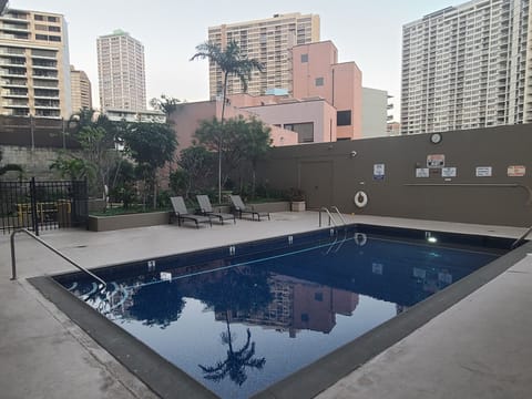 OUTDOOR POOL LOCATED ON AMENITY LEVEL WITH SUN LOUNGERS