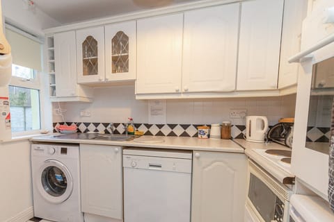 Aughrim Holiday Village No. 14. Aughrim holiday village.Bright kitchen with modern appliances.
