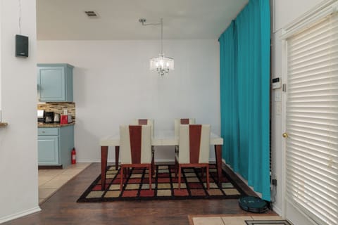 Dining area off kitchen with table and seating for 4.