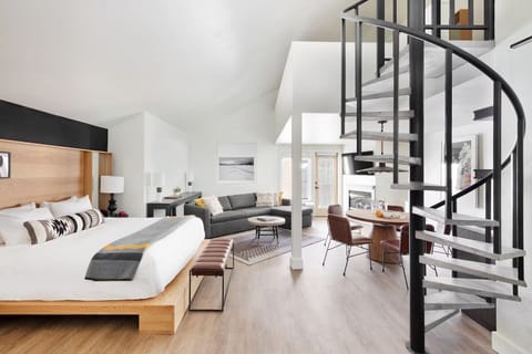 Explore the loft vibe with a dramatic spiral staircase centerpiece.