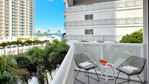 Private Corner Unit Balcony | Ocean view with a conversation seating area.