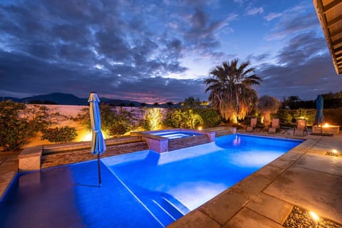 Enjoy a luxurious outdoor retreat with a temperature-controlled pool and spa.