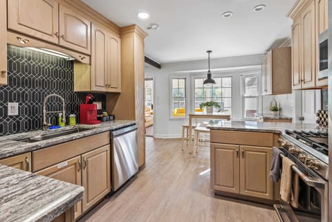 Spacious kitchen with modern appliances and charming breakfast nook — perfect for enjoying your morning coffee!
