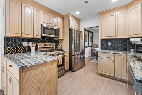 Step into a kitchen that feels like home—with a touch of luxury! Featuring sleek marble countertops, a chic backsplash, and top-notch appliances, this stylish space is perfect for cooking, gathering, and making delicious memories.