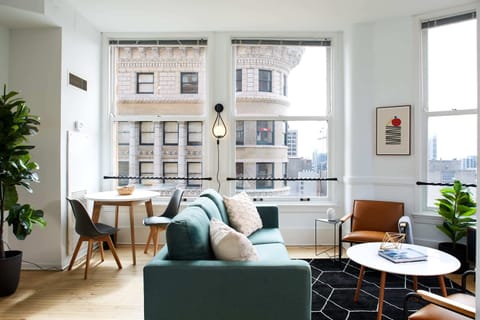 The open living room and dining area is flooded with light during the day