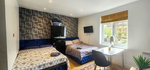 The open-plan living space features two double beds, making it ideal for couples or small groups, with plenty of comfortable seating for relaxing or socialising and views of Liverpool’s iconic Bombed Out Church.
