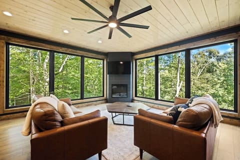 Bringing the outdoors in.  Modern Mountain Tranquility -- a secluded luxury retreat perched high in the Smoky Mountains, offering panoramic treetop views and an elevated escape like no other.