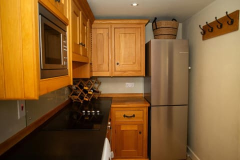 Utility with fridge/freezer, washing machine and built-in microwave