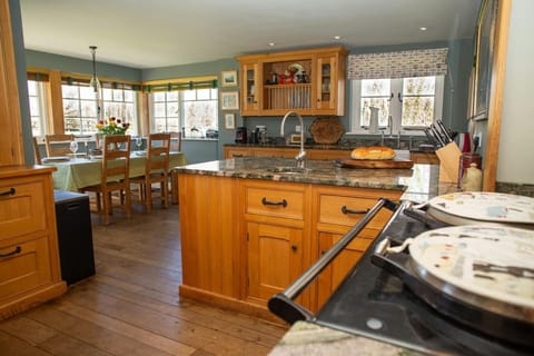 Kitchen/dining area: with Aga, leading to dining area with table and six chairs