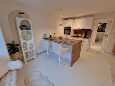 Open kitchen with integrated dining area.